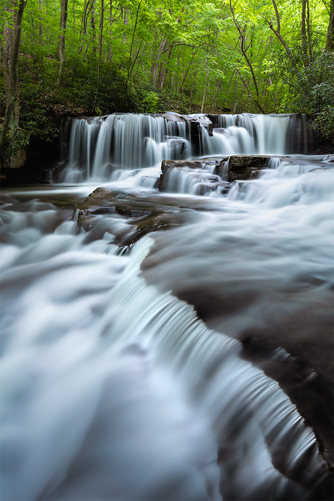 Five years ago, I stumbled upon this waterfall in Pennsylvania almost by accident. This spring, I deliberately took a short trip to visit it again. It's little known, not terribly big, yet absolutely gorgeous and photogenic. Even a weird dude in waders traversing the waterfall back and forth—risking all his photo equipment—didn't make it look any worse.